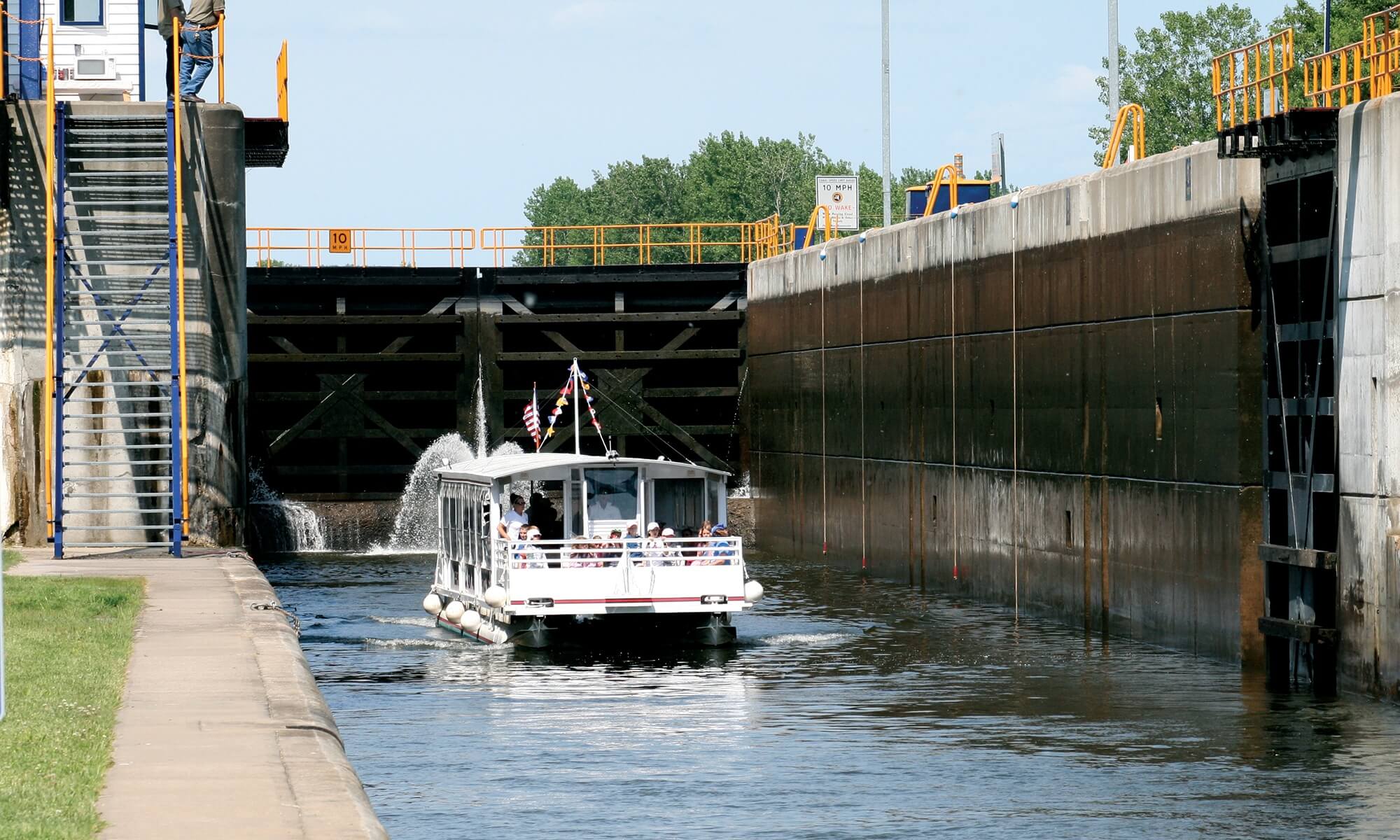 The Erie Canal Experience Image 2 a boat traveling across a bridge